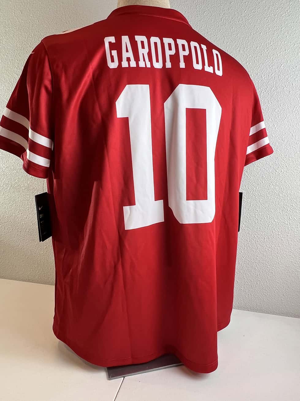Back view of the red 49ers jersey showing ‘GAROPPOLO’ and the number ‘10’ in large white print.