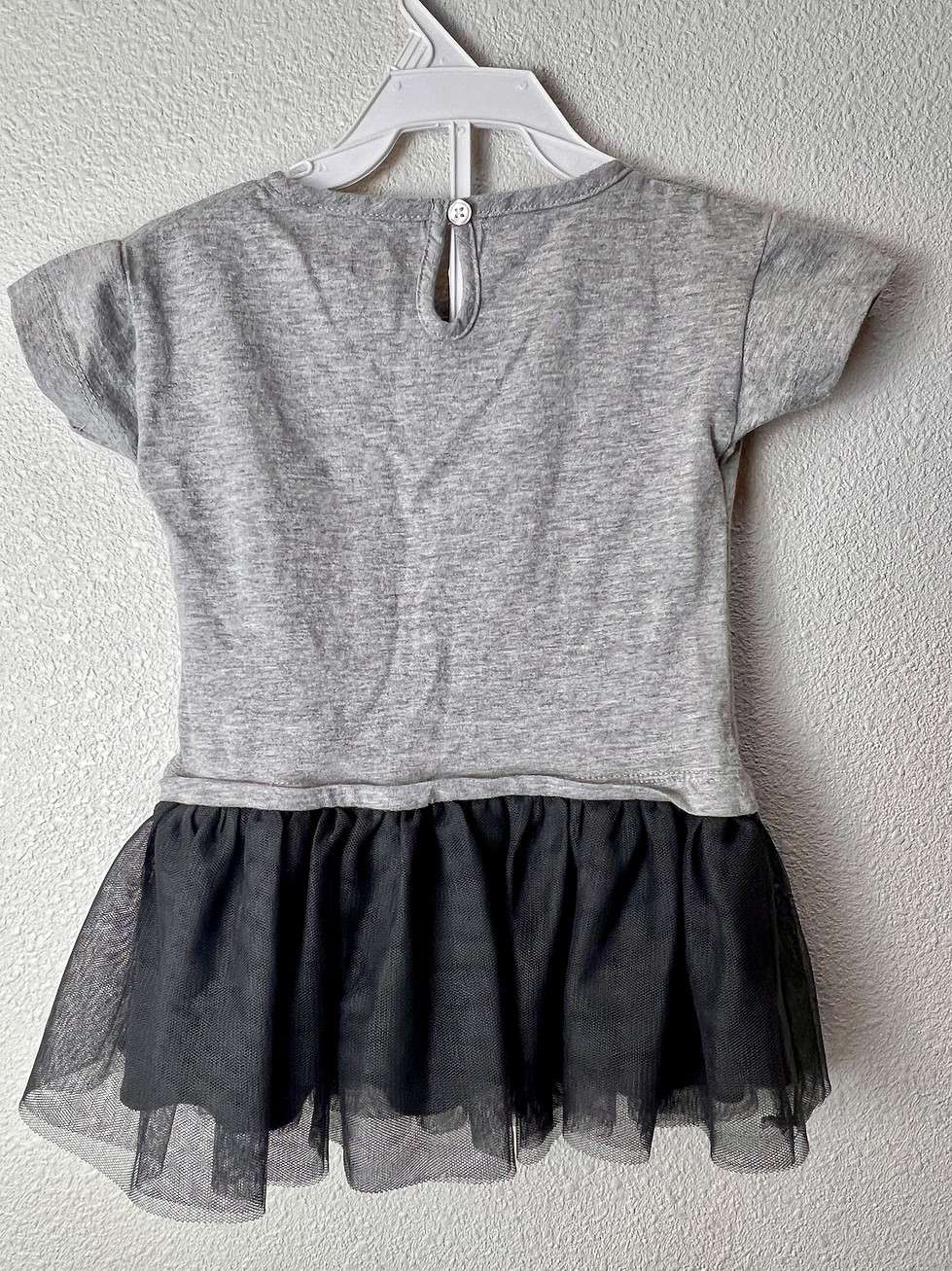 Back view of the gray toddler cheerleading dress with a black tulle skirt, ready for a young Buccaneers fan.