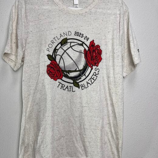 Front view of the Portland Trail Blazers t-shirt featuring a basketball and roses graphic with the 2023-24 season mark.