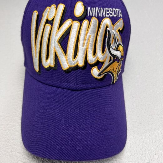 Front view of the Minnesota Vikings flex cap in vibrant purple with bold, raised golden embroidery.