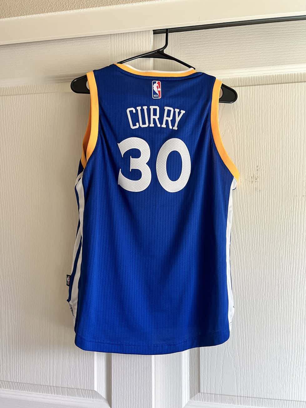 Back of Stephen Curry Youth Large Jersey in blue