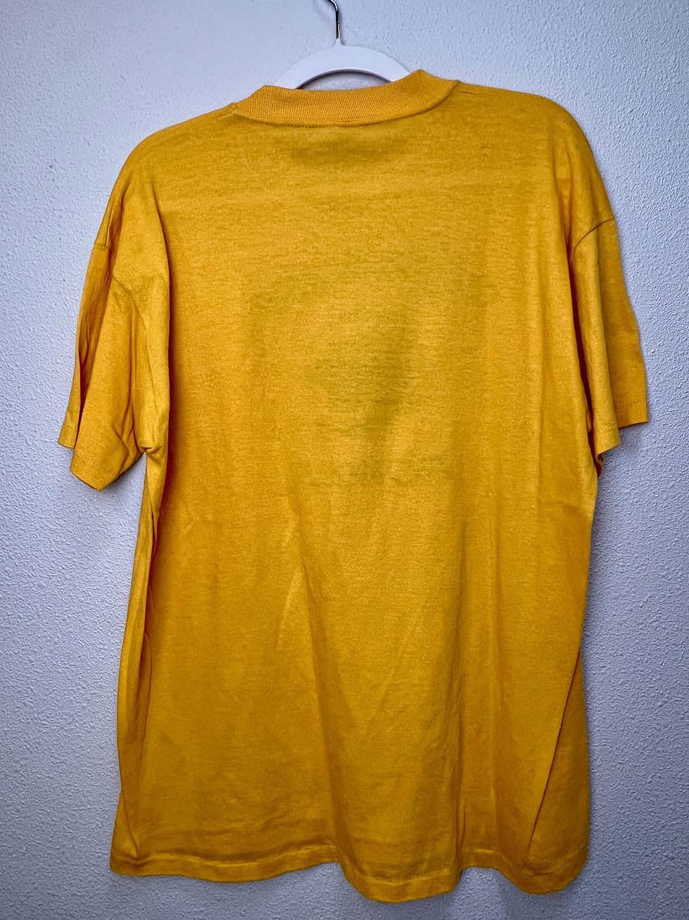 Back view of vintage Chargers t-shirt in bright yellow.