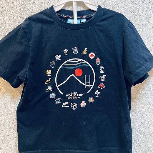 Front view of Rugby World Cup Japan 2019 kids t-shirt. International rugby association logos are displayed in a circle on the front, with the 2019 logo in the middle.