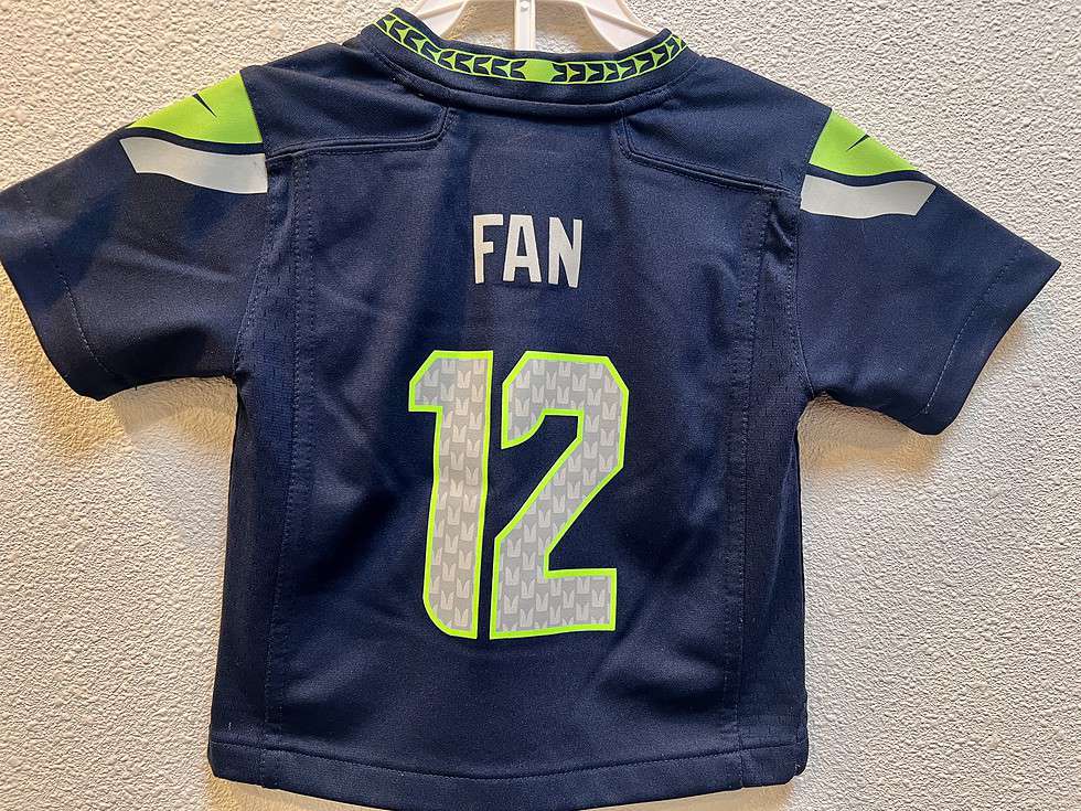 Back view of Seattle Seahawks 12th Man youth jersey showing "FAN" and number 12.