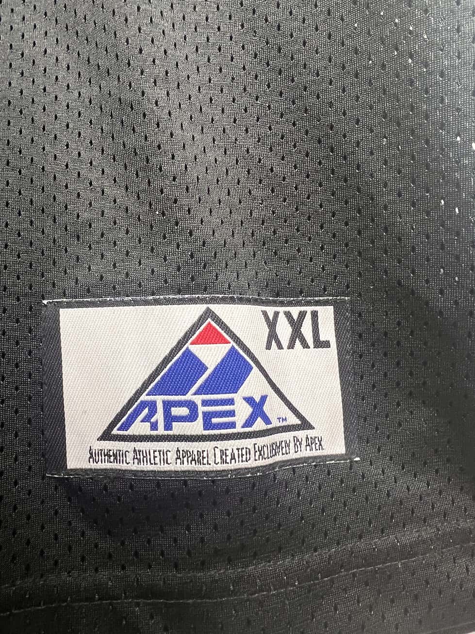 View of jersey label featuring Apex logo and XXL indicating jersey size.