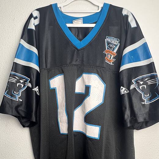 Front view of the vintage Kerry Collins Carolina Panthers jersey with number 12 and Inaugural Season patch.