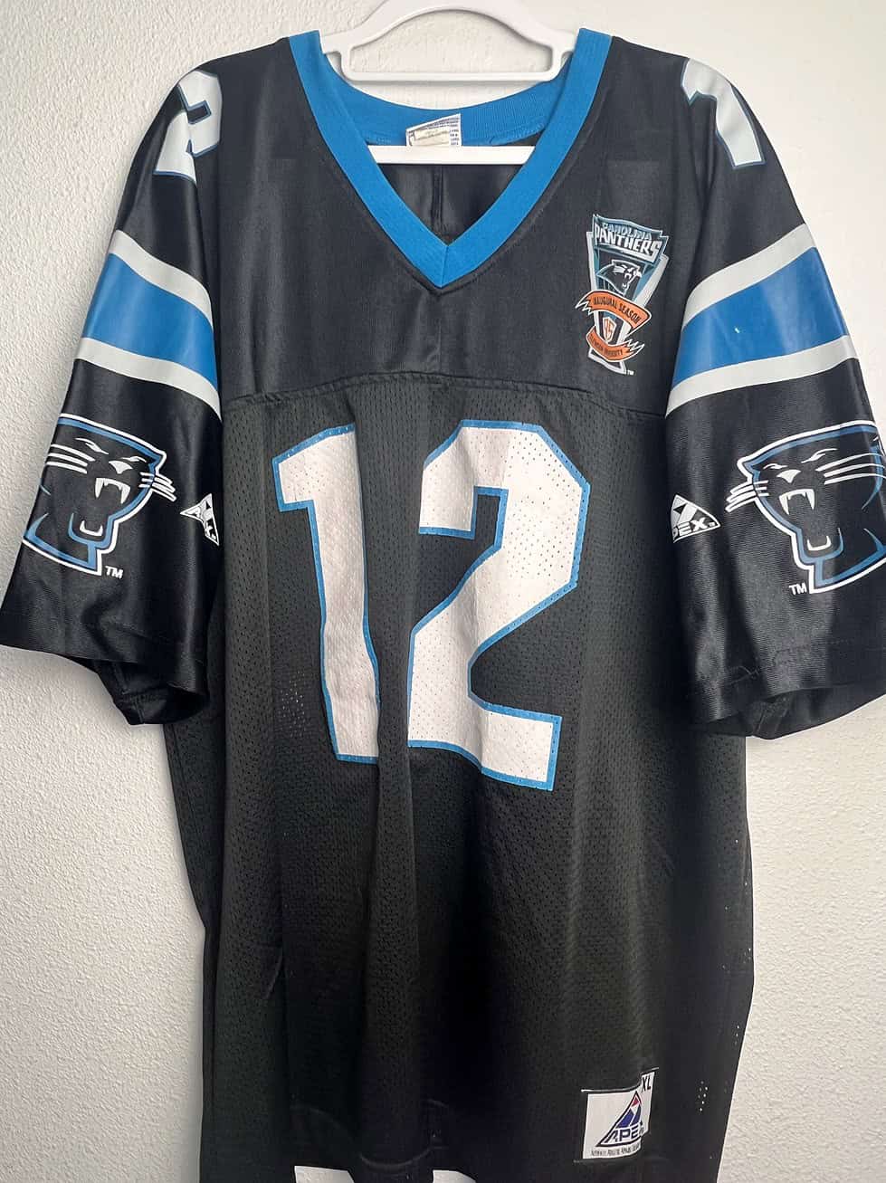 Front view of the vintage Kerry Collins Carolina Panthers jersey with number 12 and Inaugural Season patch.