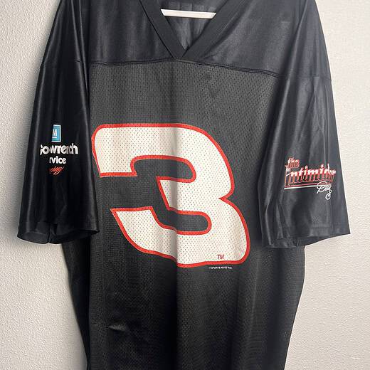 Vintage black Dale Earnhardt Sr. NASCAR Jersey featuring the number 3 on the front, displayed on a hanger.