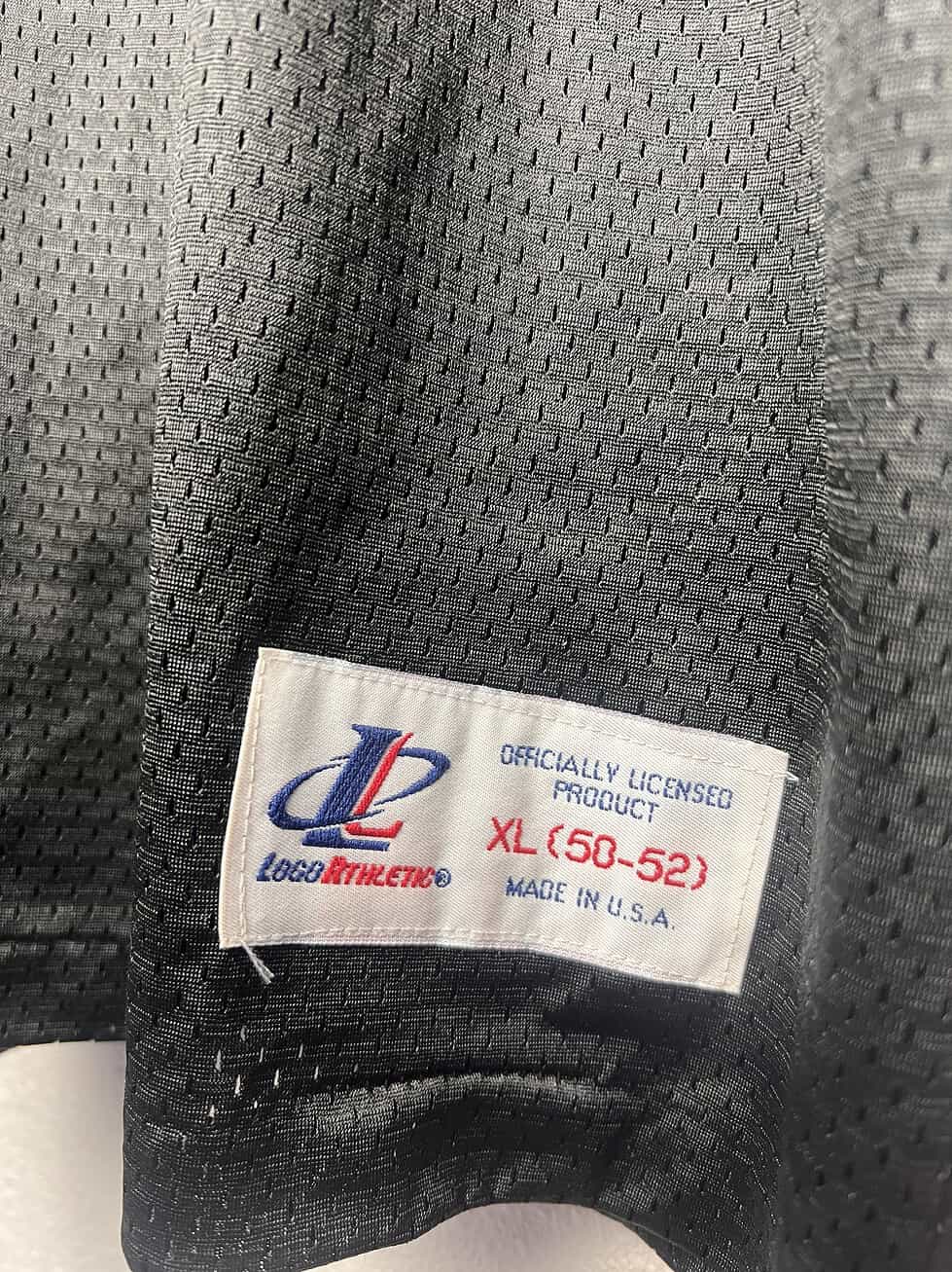 Close-up of the Logo Athletic tag on the Dale Earnhardt Sr. NASCAR Jersey, showing size XL (50-52)