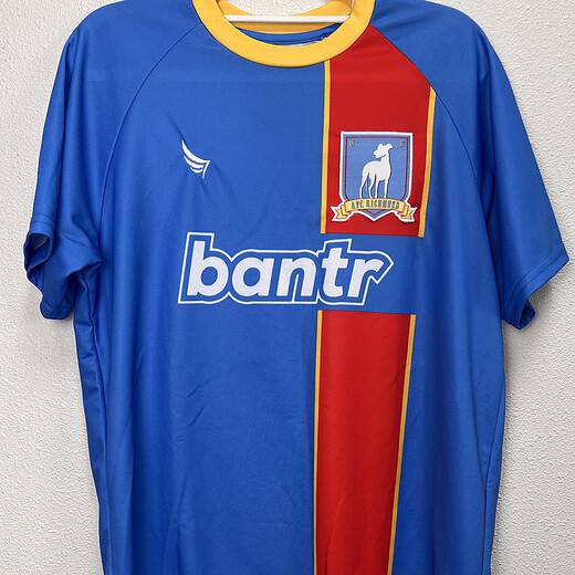 Front view of the Ted Lasso AFC Richmond Jersey featuring the team's crest and "bantr" sponsor logo.