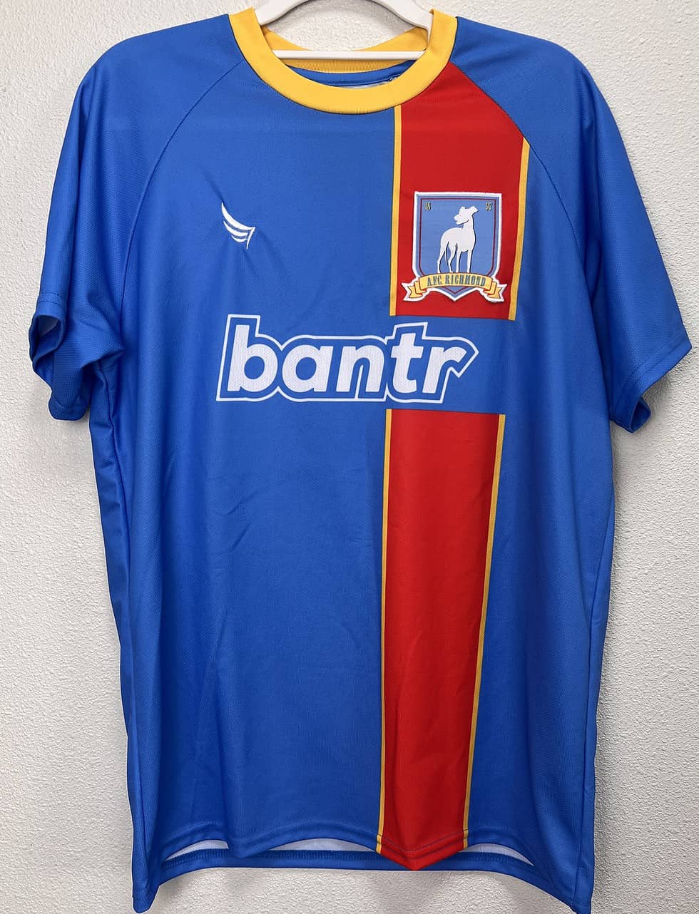 Front view of the Ted Lasso AFC Richmond Jersey featuring the team's crest and "bantr" sponsor logo.
