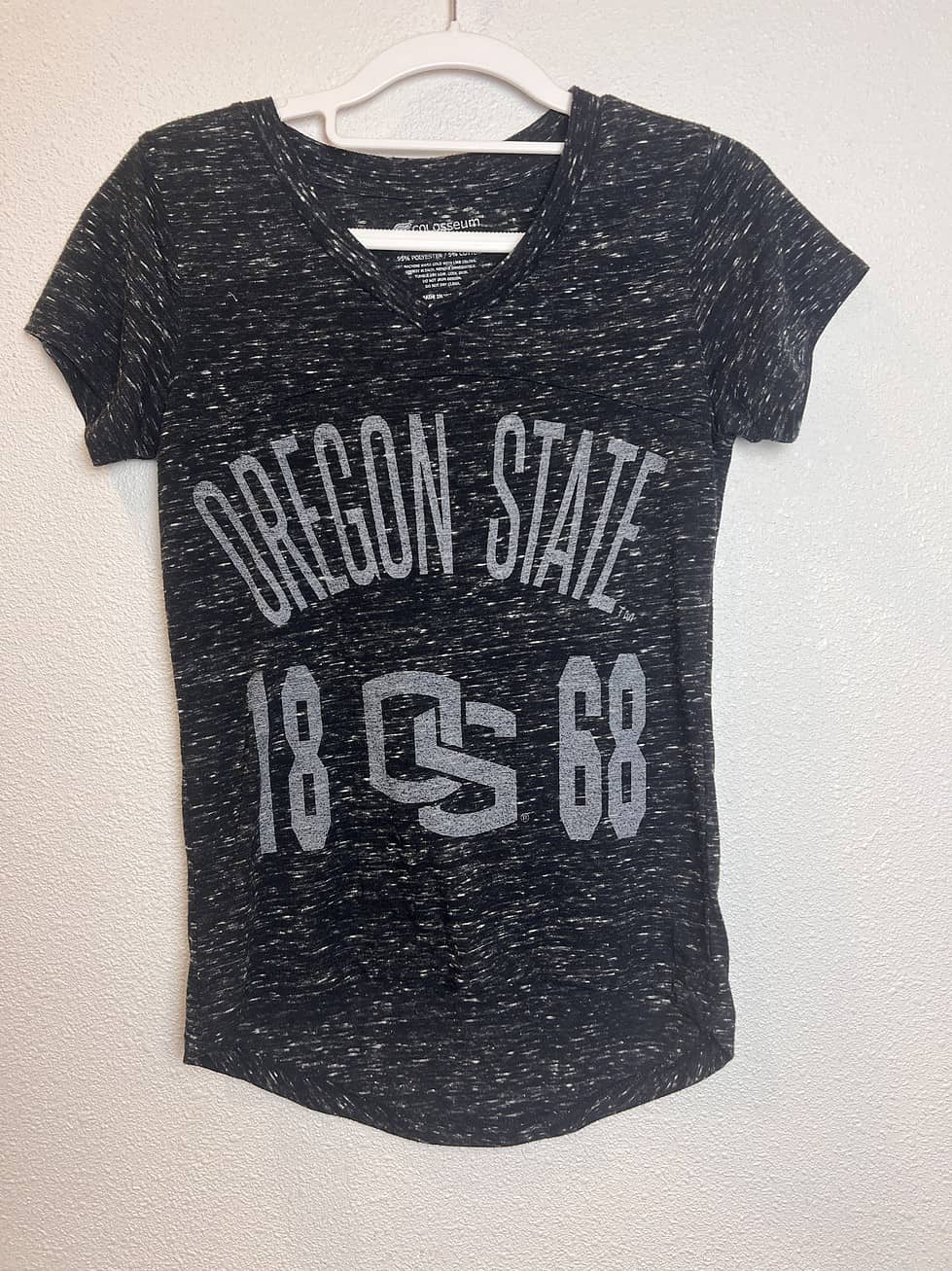 Front view of Oregon State University V-neck T-shirt, black with speckled design, featuring "Oregon State 1868" graphic.