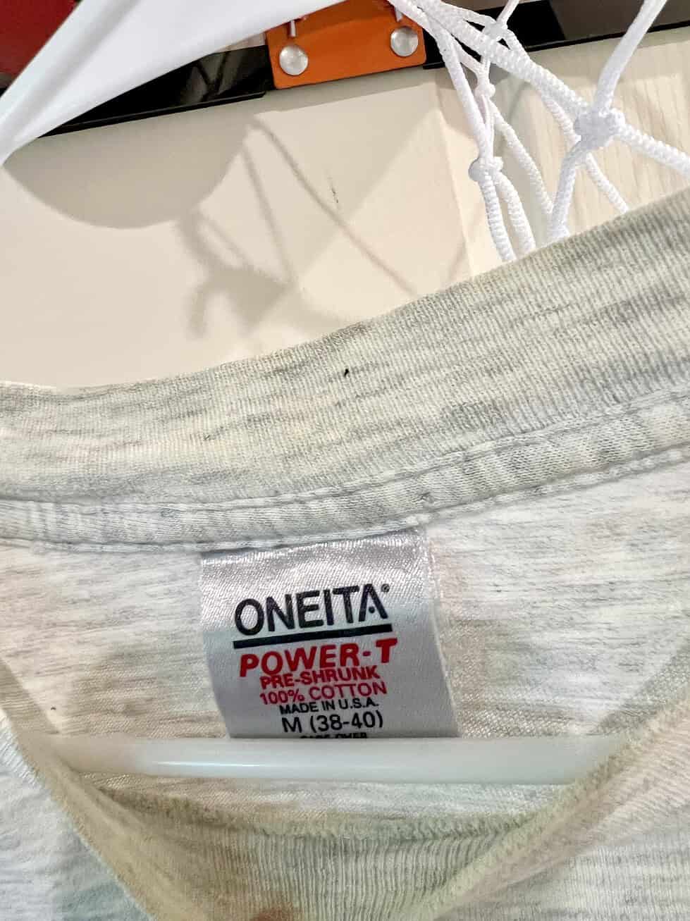 Close-up of Oneita Power-T label on vintage Atlanta 1996 Olympics T-Shirt, size Medium.