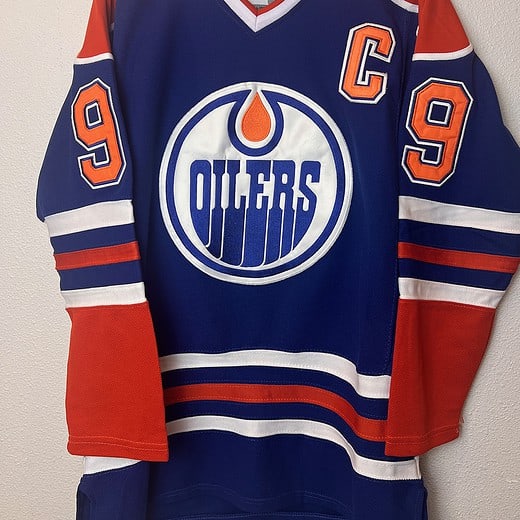 Front view of a Wayne Gretzky Edmonton Oilers CCM jersey with the captain’s "C" patch and Oilers logo.
