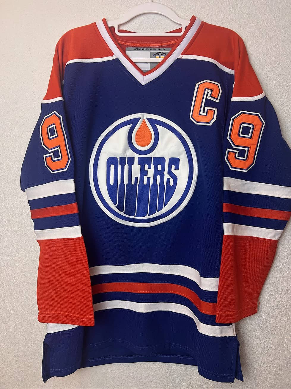 Front view of a Wayne Gretzky Edmonton Oilers CCM jersey with the captain’s "C" patch and Oilers logo.