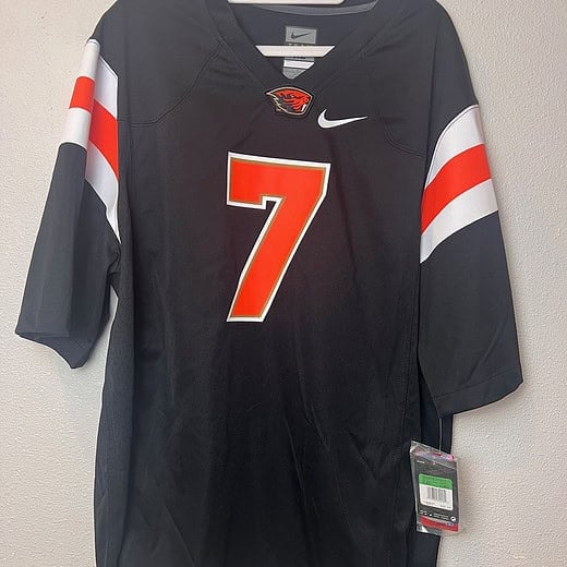Front view of Oregon State Beavers #7 black Nike replica jersey, size XL, with orange and white accents, new with tags.