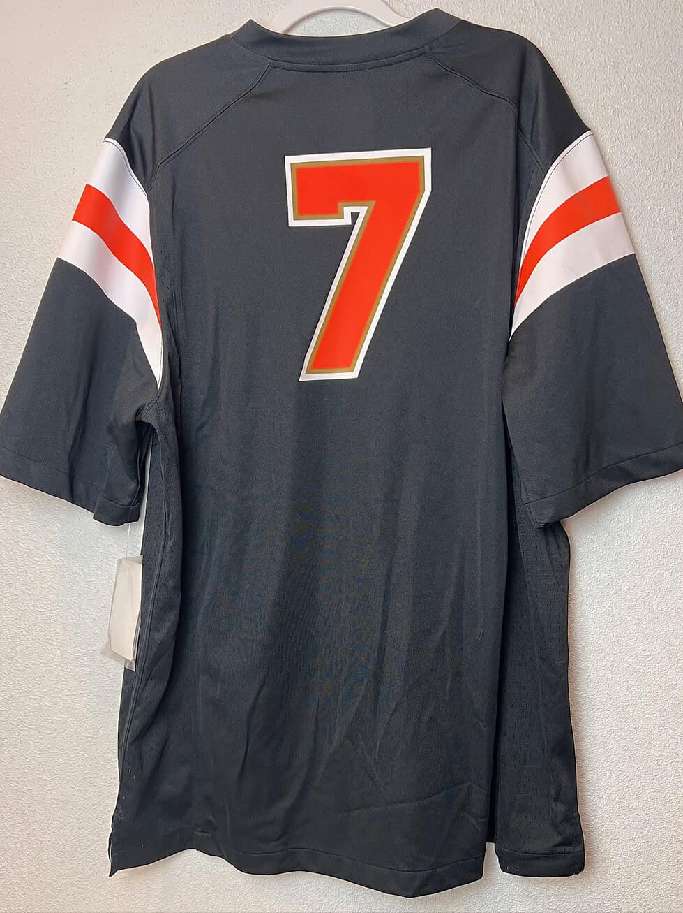 Back view of the Oregon State Beavers #7 black Nike replica jersey with orange and white accents.