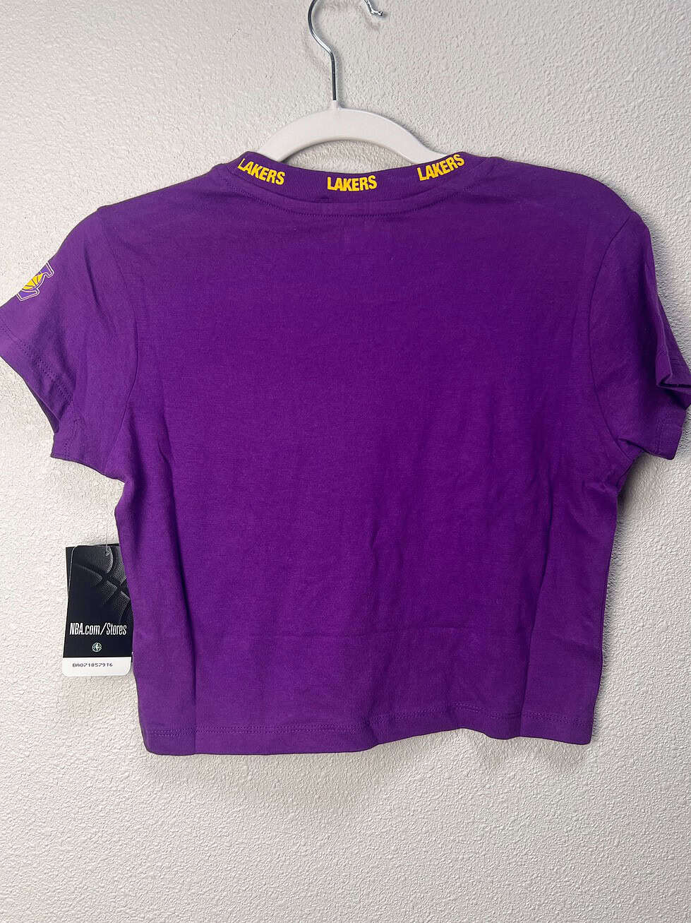 Back view of a purple Los Angeles Lakers women’s crop tee by New Era, size XS.