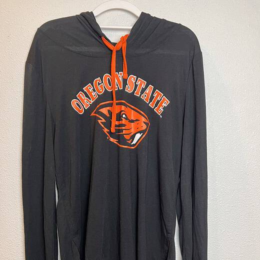 Full front view of hooded long sleeve, emphasizing its soft fabric and laid-back style.