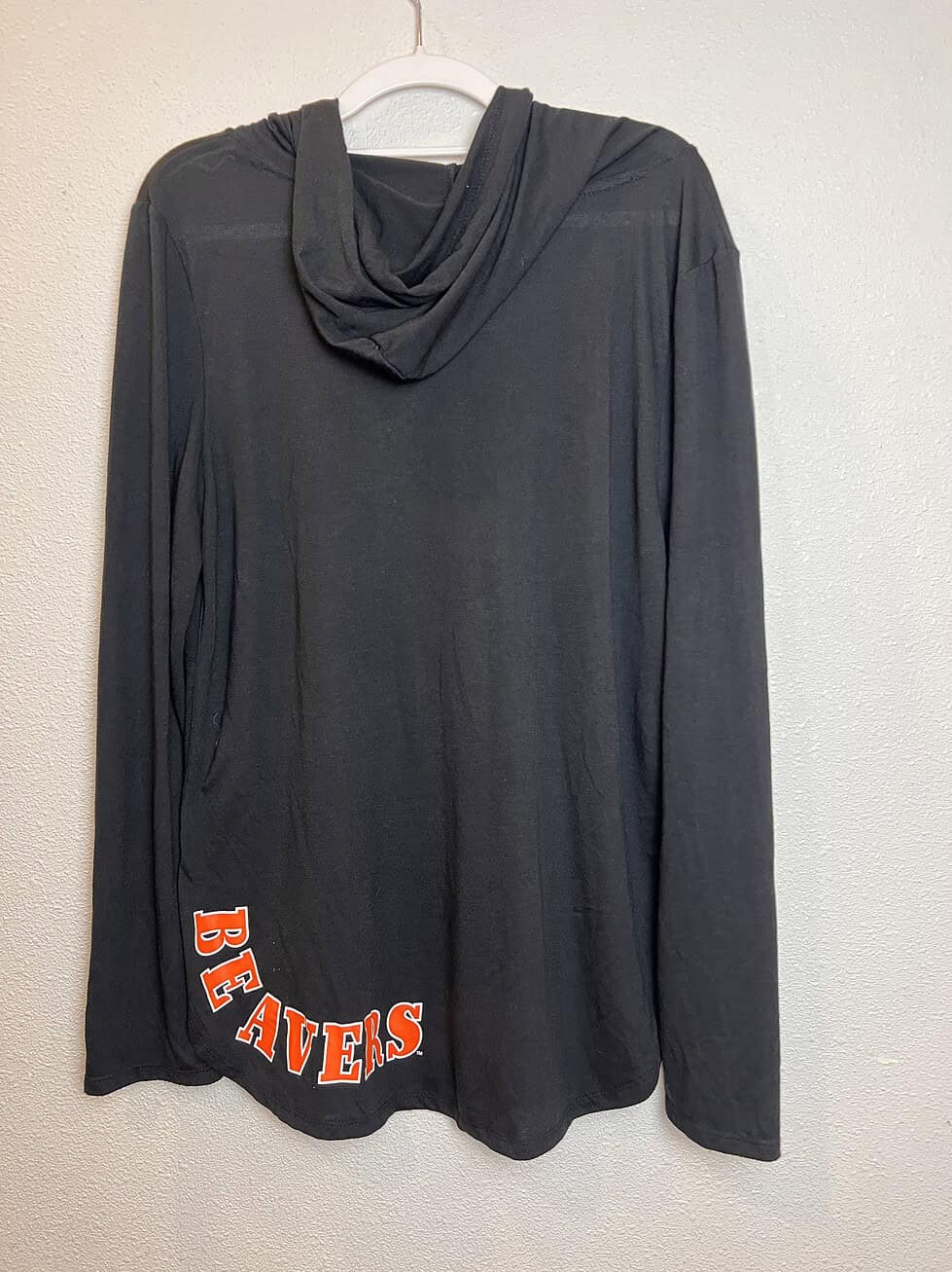 Back view of black Colosseum Oregon State Beavers hooded long sleeve, showing “Beavers” text in orange on the hem.