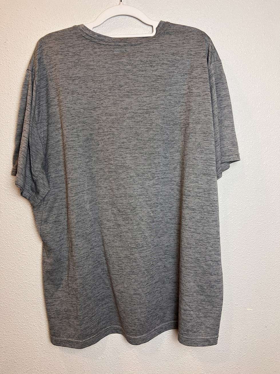 Back view showing the heather gray fabric and relaxed fit.