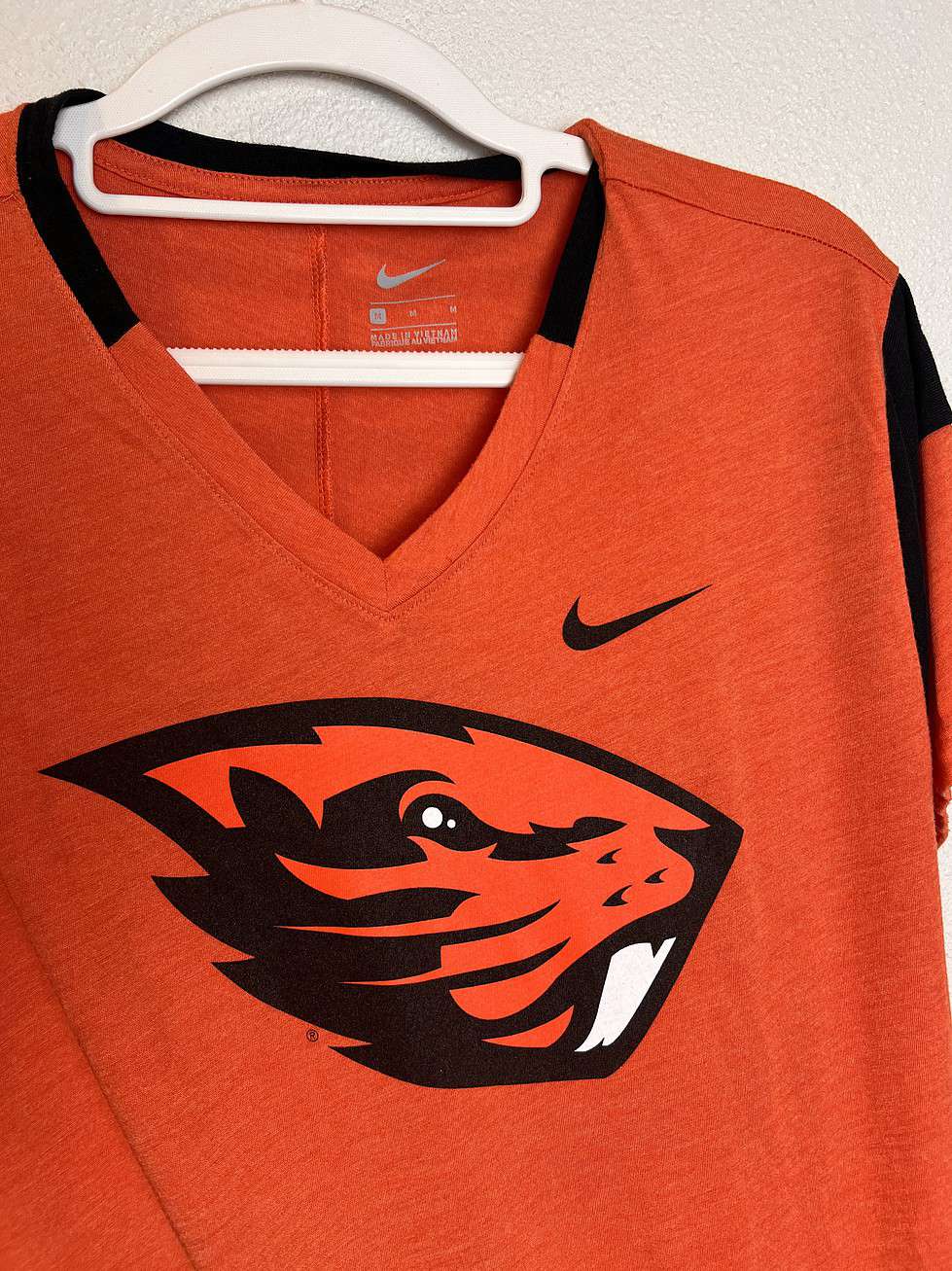 Close-up of Nike branding and Beavers logo details.