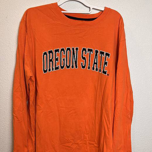 Front view of vintage Oregon State long-sleeve tee with varsity-style lettering in bold black and white.