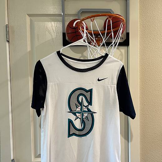 Front view of Seattle Mariners Nike T-Shirt featuring the classic team logo in teal and navy.