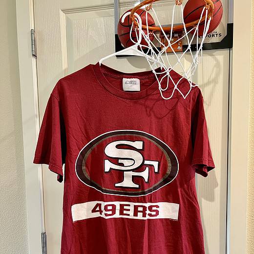 Front view of vintage San Francisco 49ers T-Shirt featuring bold logo and “49ers” text.