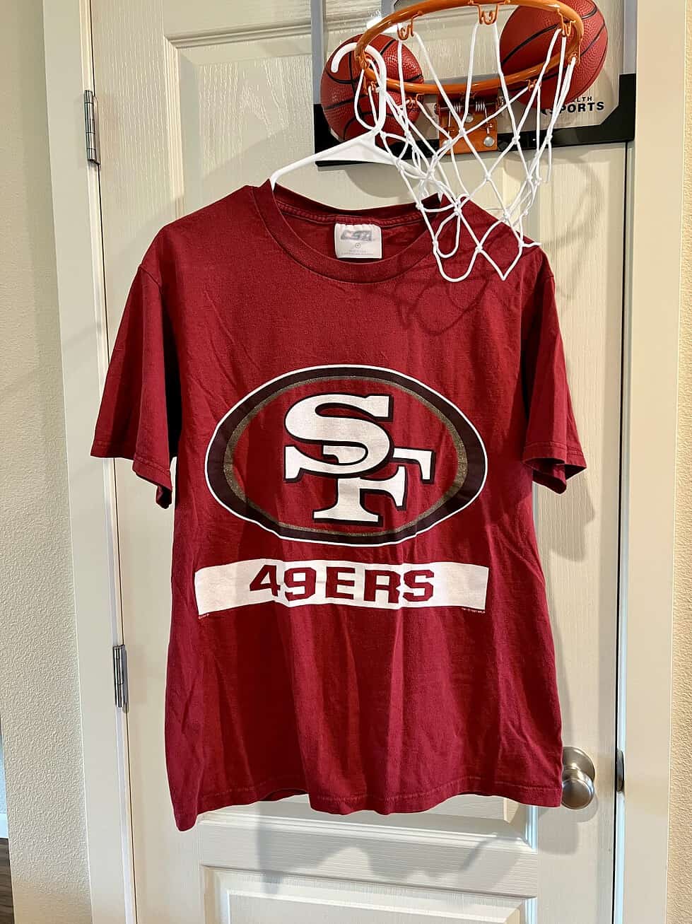Front view of vintage San Francisco 49ers T-Shirt featuring bold logo and “49ers” text.