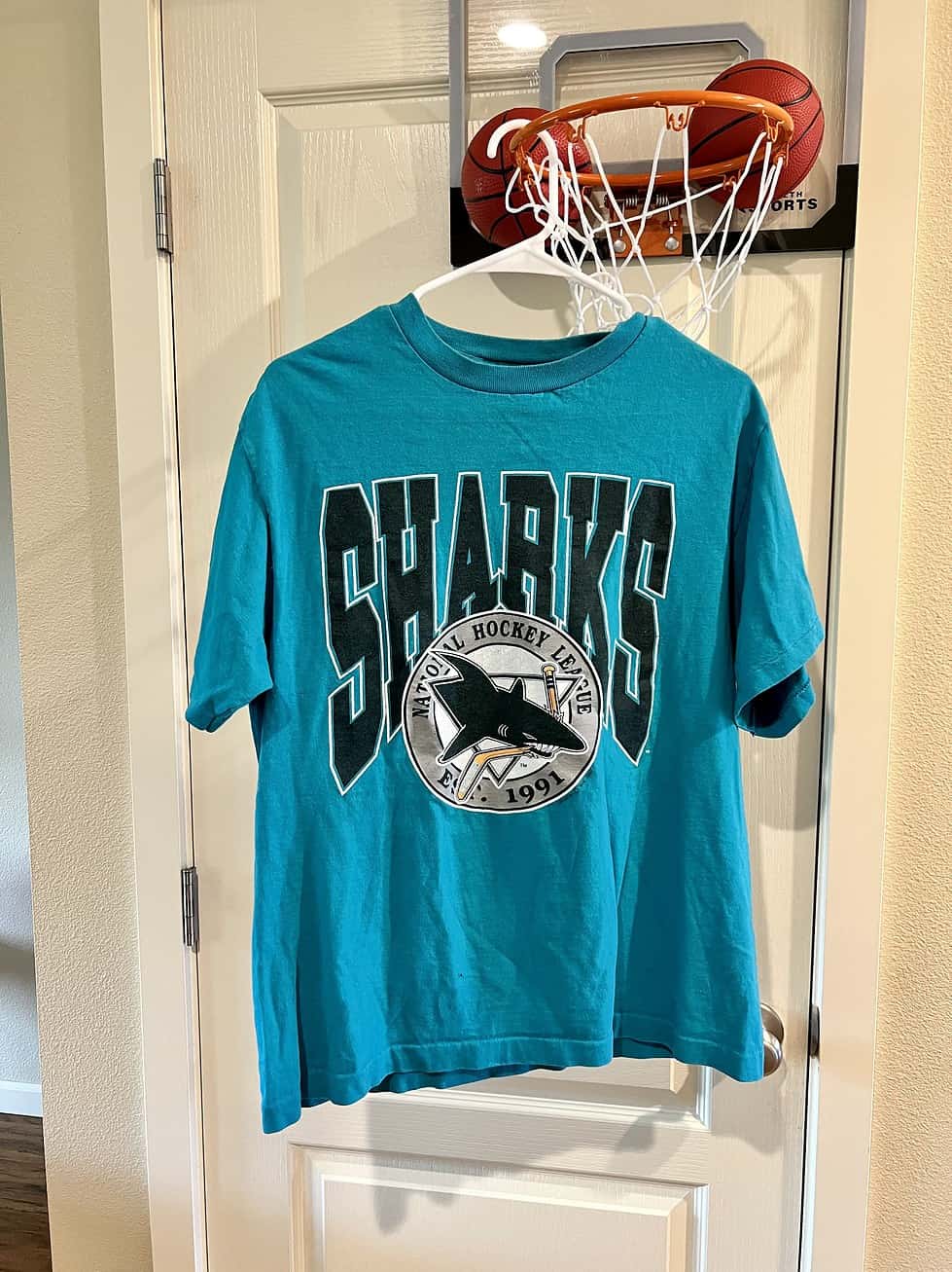 Front view of vintage San Jose Sharks T-Shirt with original logo and NHL graphic.