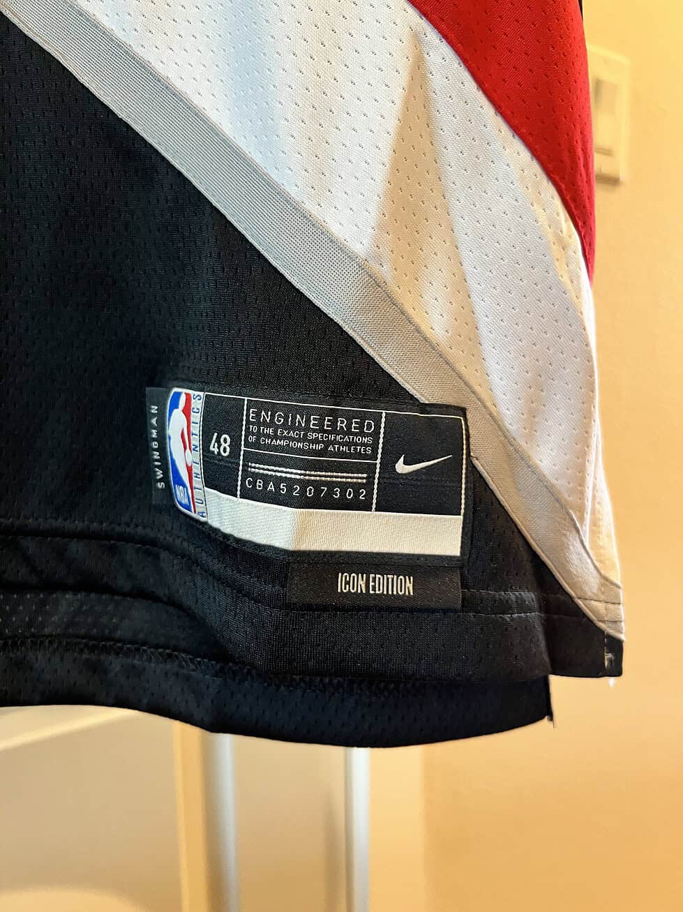 Close-up of Nike and NBA labels on Shaedon Sharpe Portland Trail Blazers Icon Edition Jersey, size 48.