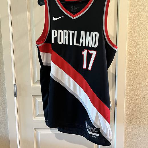 Front view of Portland Trail Blazers Jersey with “Portland” text and number 17 in red and white.