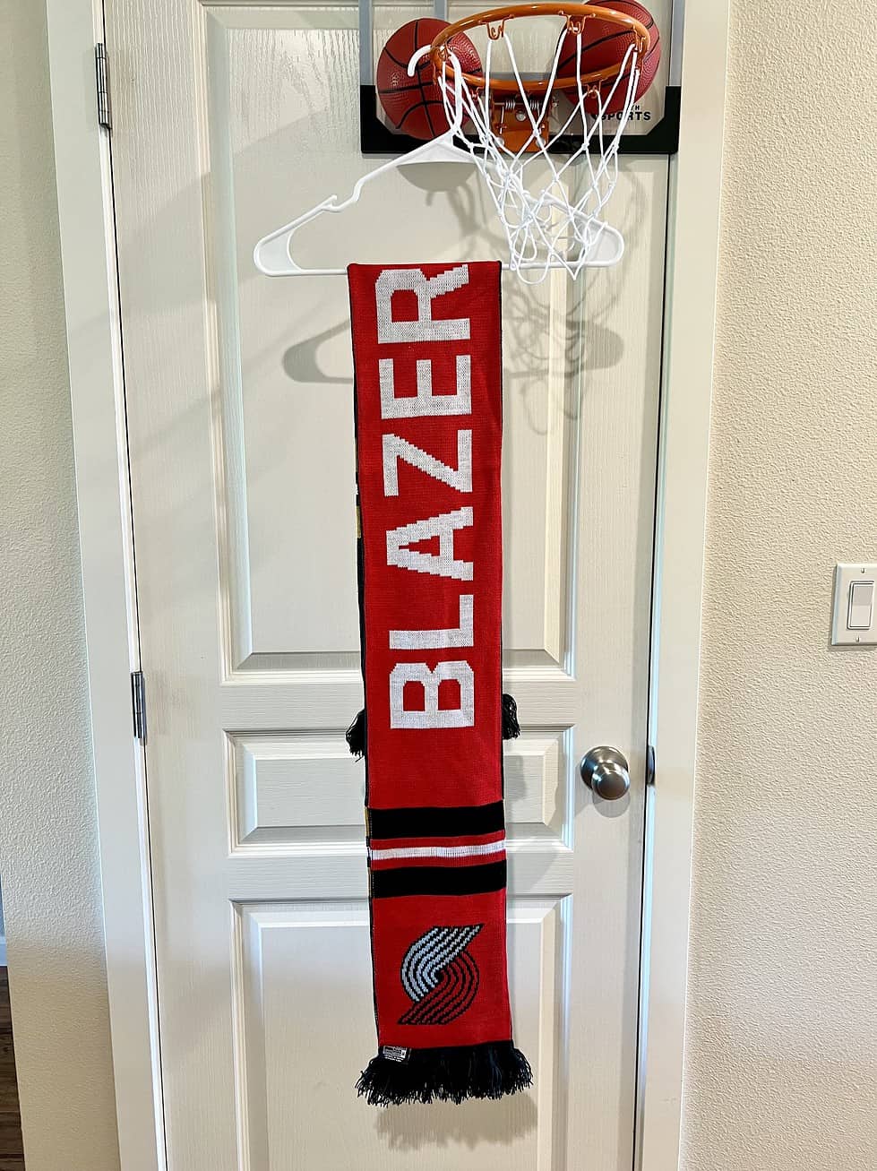 Full view of the Portland Trail Blazers side of the reversible scarf in red and black.