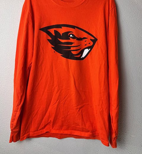Front view of orange Oregon State long-sleeve with "Angry Benny" logo.