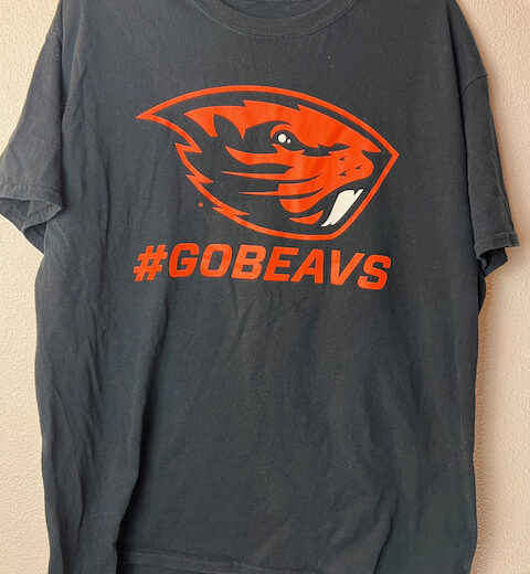 Front of black Oregon State Beavers tee with bright orange logo and #GoBeavs graphic.