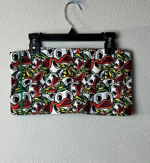 Front view of Oregon Ducks tube top with all-over Puddles design.