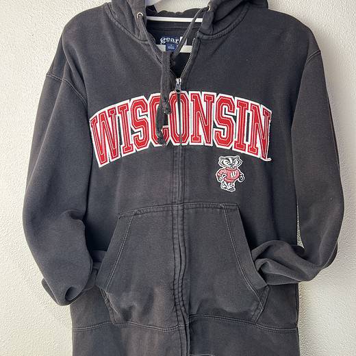 Front of Wisconsin Badgers hoodie with red “WISCONSIN” lettering and Bucky Badger logo.