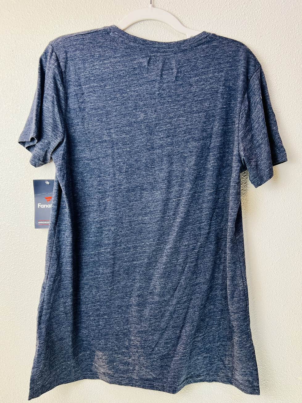 Back view of heathered navy Michigan fan tee with original tags attached.