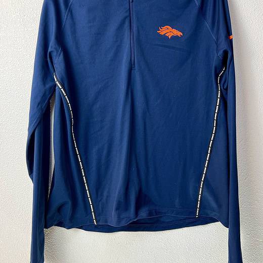 Front view of Nike Dri-FIT Denver Broncos 1/4 zip pullover in navy blue.