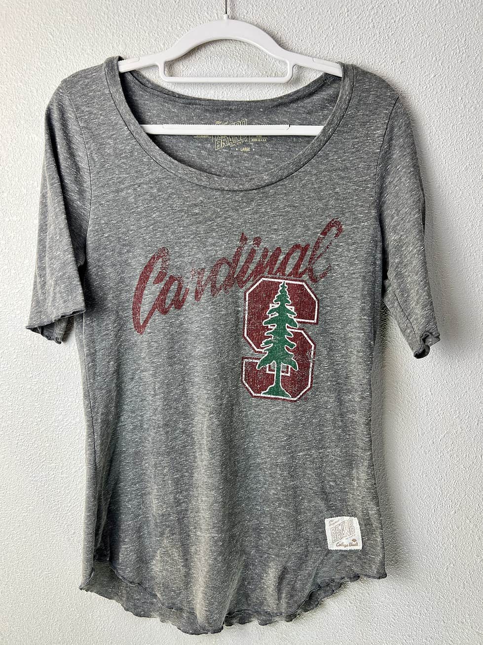 Front view of Stanford Cardinal women’s tee with distressed logo and scoop neck.