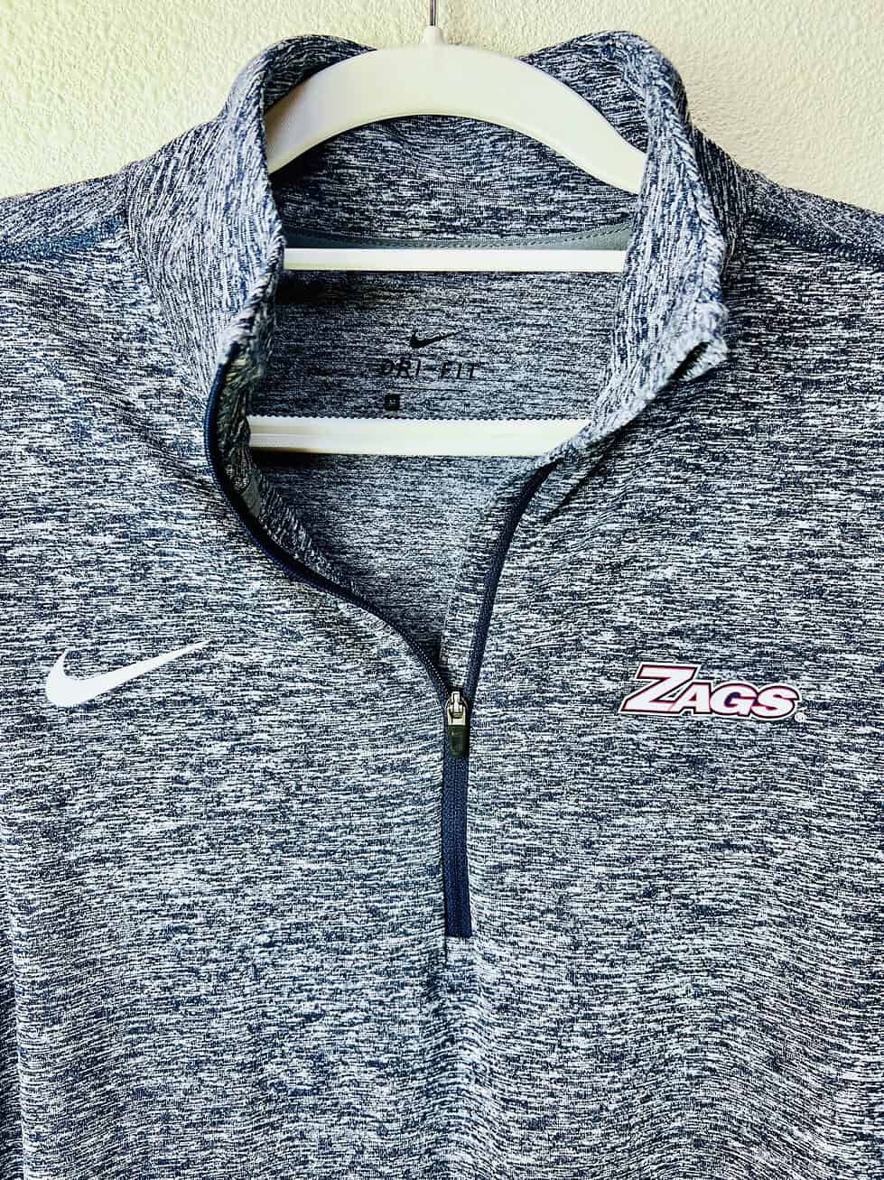 Close-up of embroidered "Zags" logo and Nike Swoosh on Gonzaga pullover.