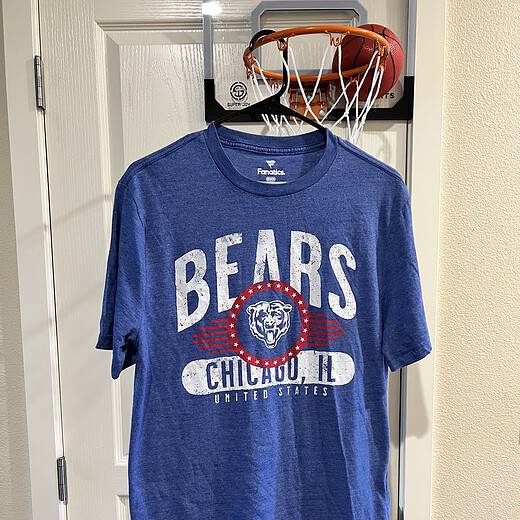 Front view of a blue Fanatics T-shirt with distressed Chicago Bears graphics, Adult Medium.