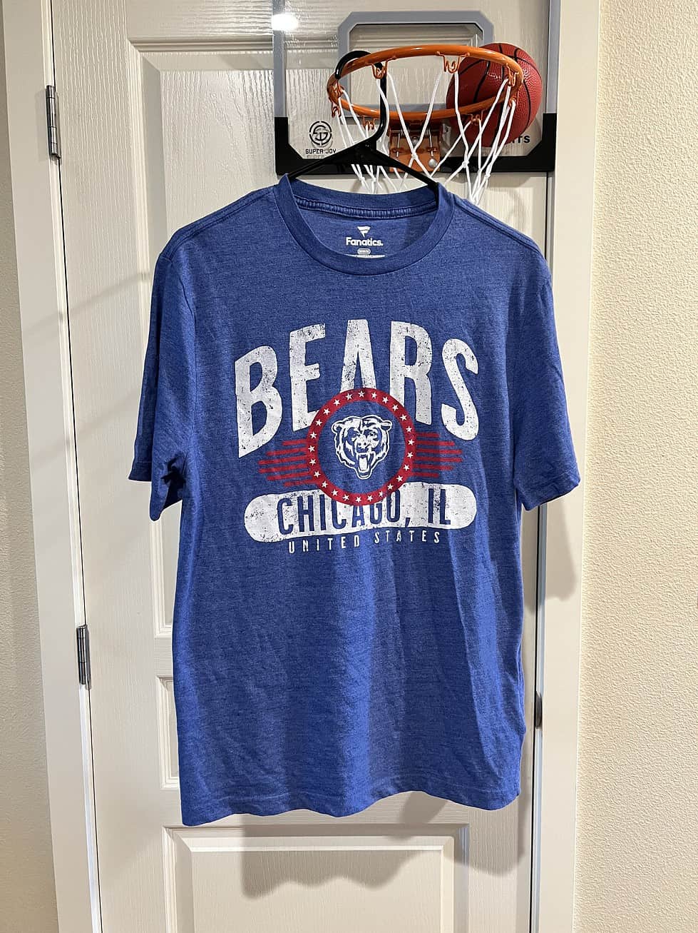 Front view of a blue Fanatics T-shirt with distressed Chicago Bears graphics, Adult Medium.