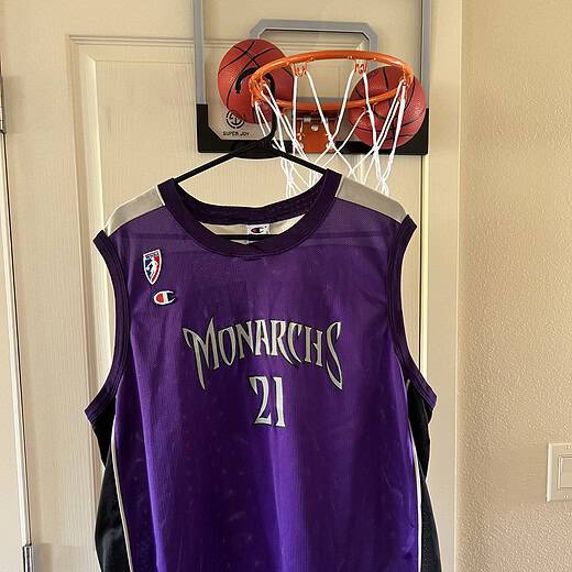 Front of jersey with "Monarchs" in silver and WNBA logo.