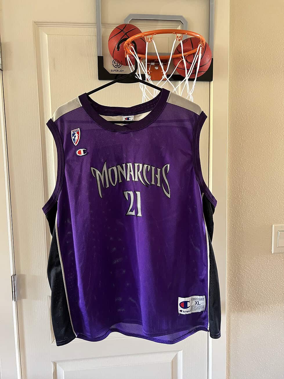 Front of jersey with "Monarchs" in silver and WNBA logo.