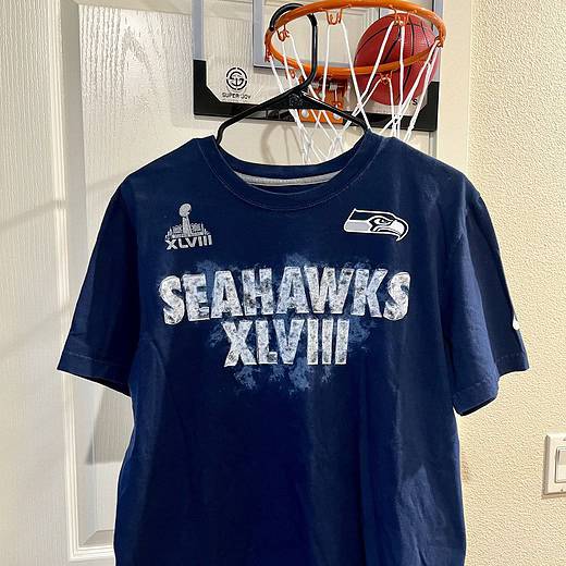 Front view of a navy blue Nike T-shirt with “Seahawks XLVIII” graphic and Super Bowl logo.