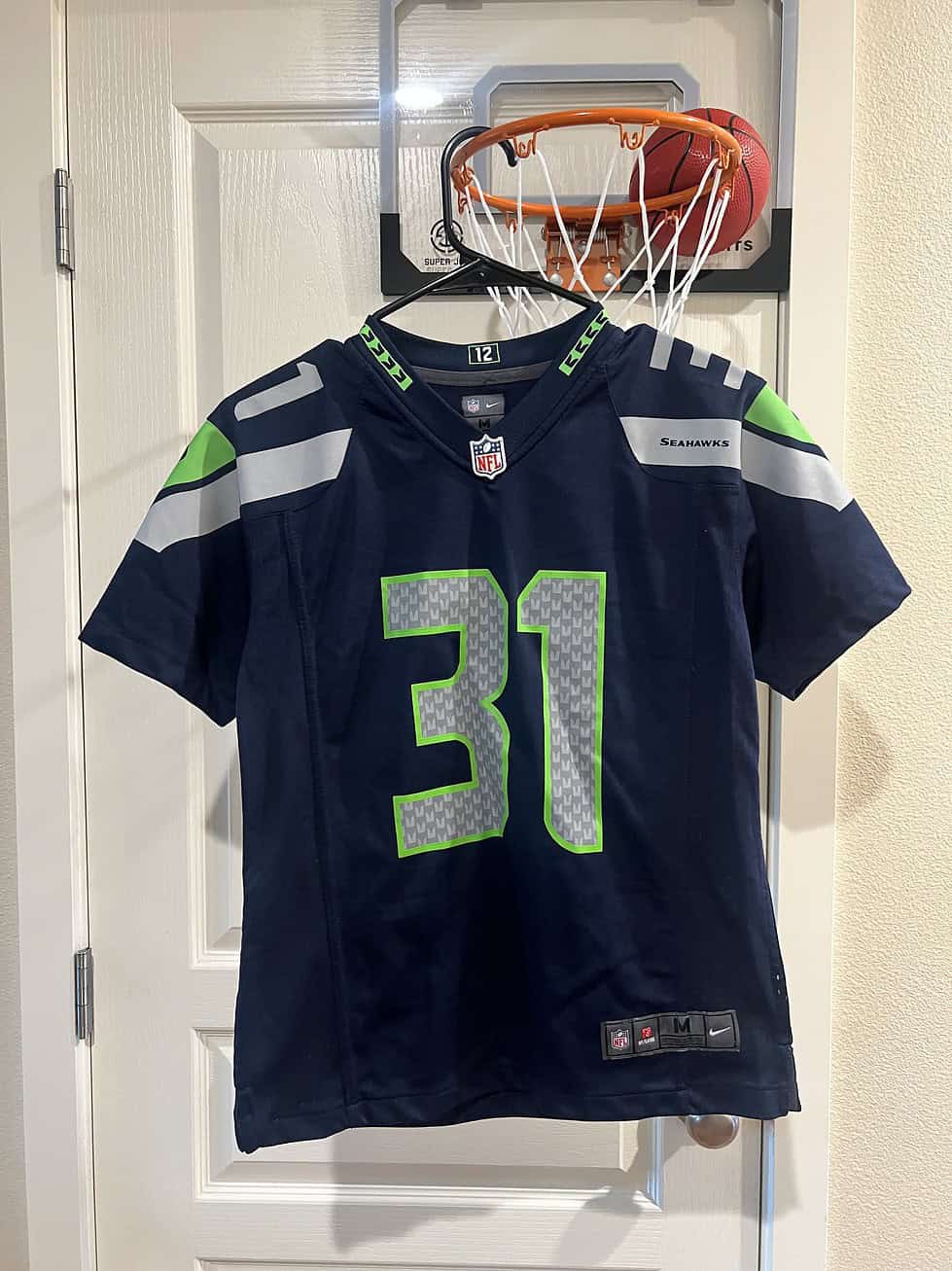 Front view of a Kam Chancellor #31 youth jersey with Seahawks branding and NFL logo.