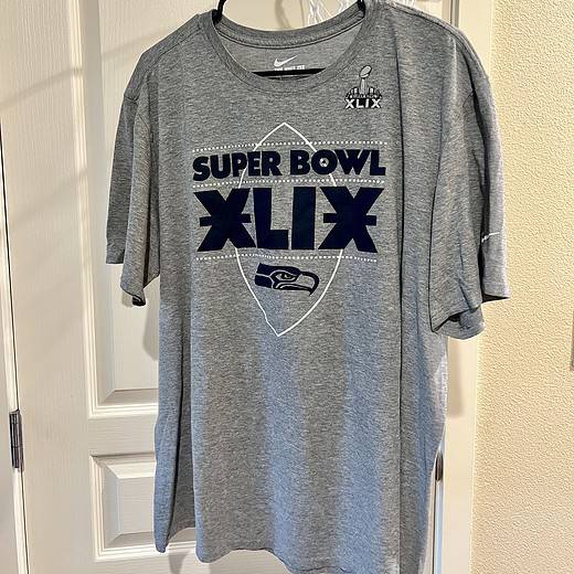 Front view of a gray Seattle Seahawks T-shirt with "Super Bowl XLIX" text and Seahawks logo.