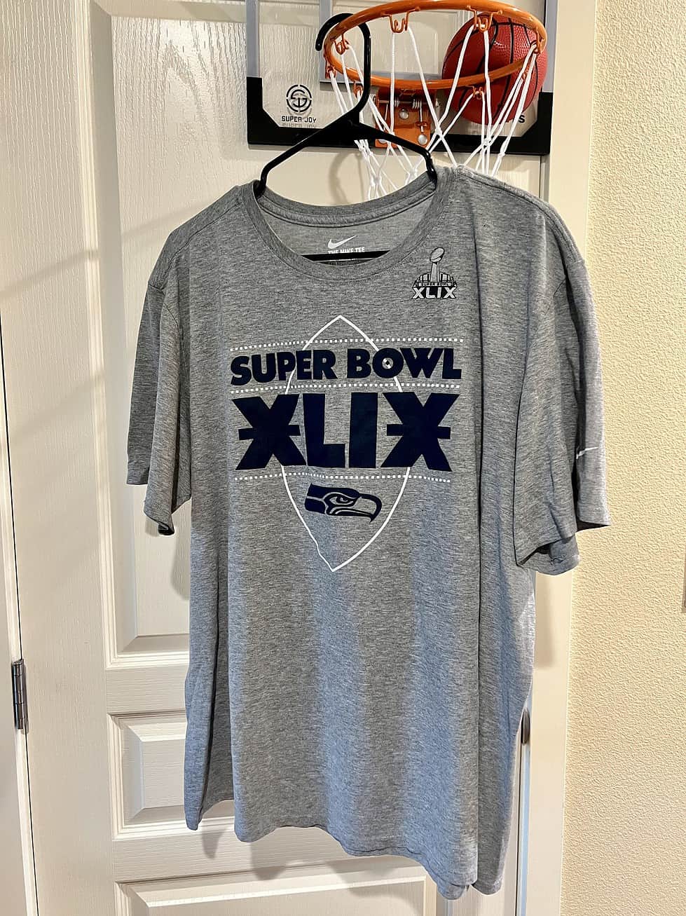 Front view of a gray Seattle Seahawks T-shirt with "Super Bowl XLIX" text and Seahawks logo.